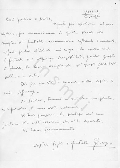 L’immagine riproduce la fotocopia della diciannovesima facciata del testamento spirituale di Giorgio Mainadi, scritto ai genitori poco prima di unirsi ai partigiani. Trattasi della prima facciata del terzo messaggio, scritto il 3 novembre 1943 da Costozza. Il documento originale è scritto sul fronte di un foglio bianco. 