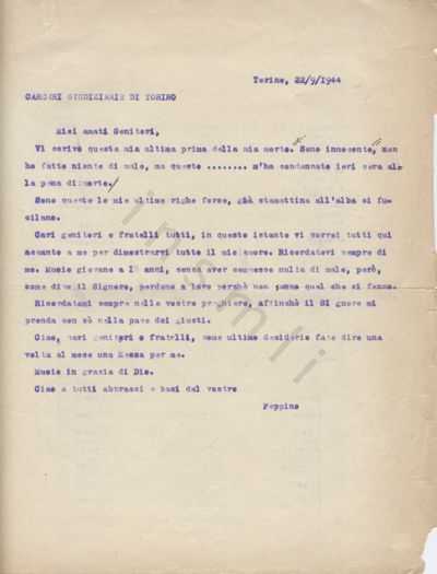 L’immagine riproduce la trascrizione a macchina dell’ultima lettera scritta da Giuseppe Bocchiotti ai genitori, dalla sua cella nelle carceri di Torino. Il documento è dattilografato in inchiostro viola, con alcuni segni manoscritti in penna nera lungo il testo.